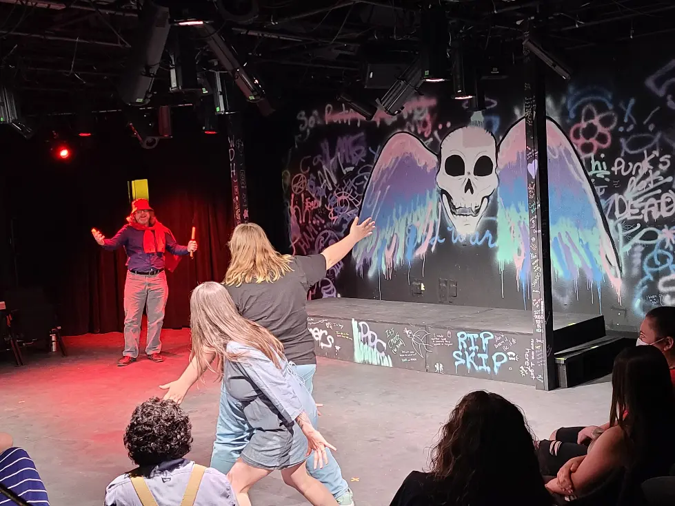 Actors perform on stage