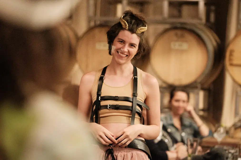 A Shakespeare performer wearing horns