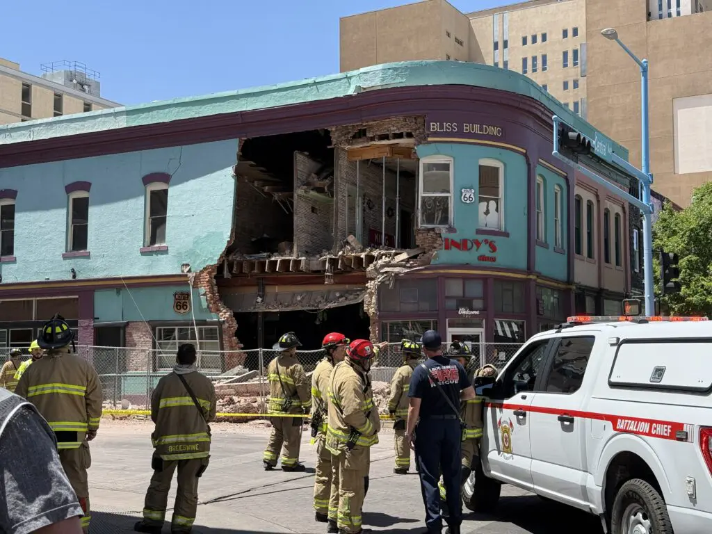 Albuquerque Fire & Rescue personnel respond to the Bliss Building where the exterior wall collapsed