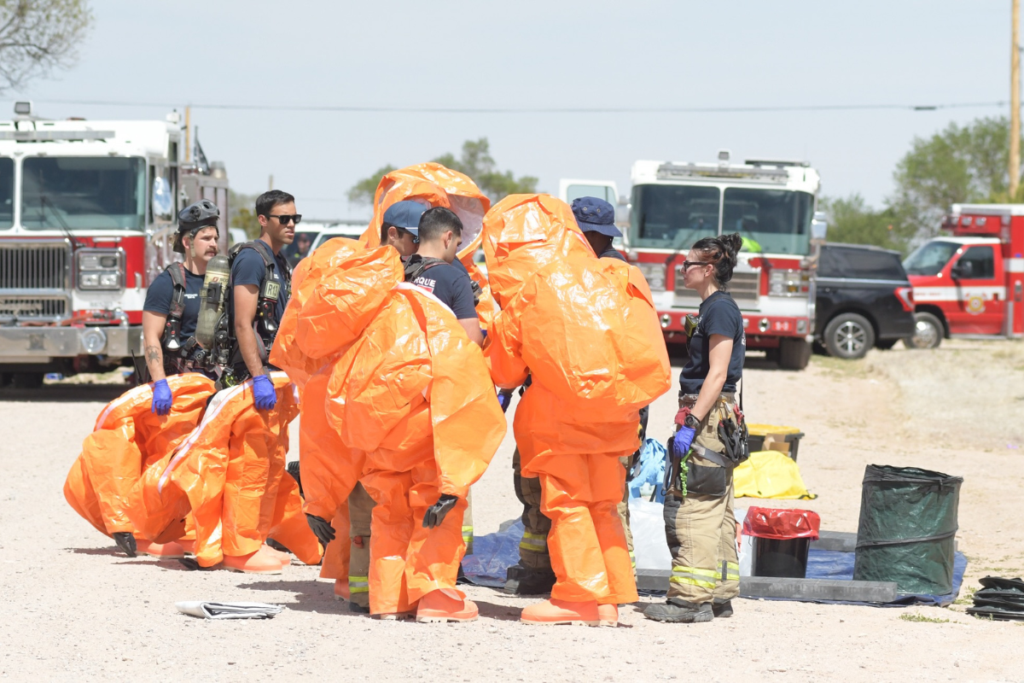 Albuquerque Fire Rescue HazMat teams work May 20 after Three people died and 19 others were hospitalized — including 18 first responders — after an unidentified substance was discovered at a Mountainair residence. (AFR)