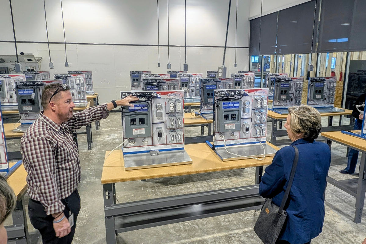 American Federation of Teachers President Randi Weingarten, right, listens to RioTECH Principal Dr. Kristopher Johnson during a tour of the school on May 18. (Kevin Hendricks)