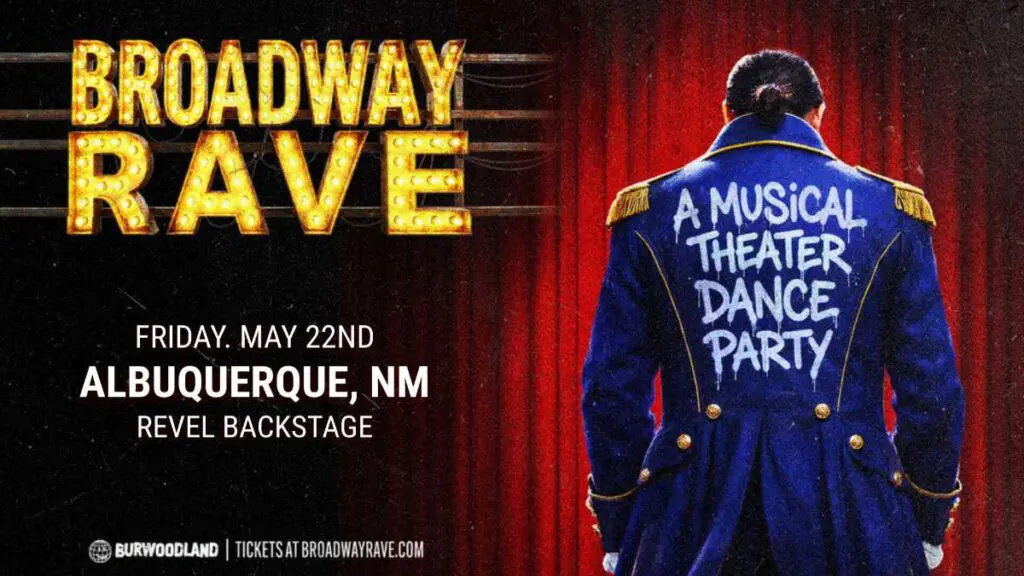 A man in a Broadway stage costume stands with his back to the camera.