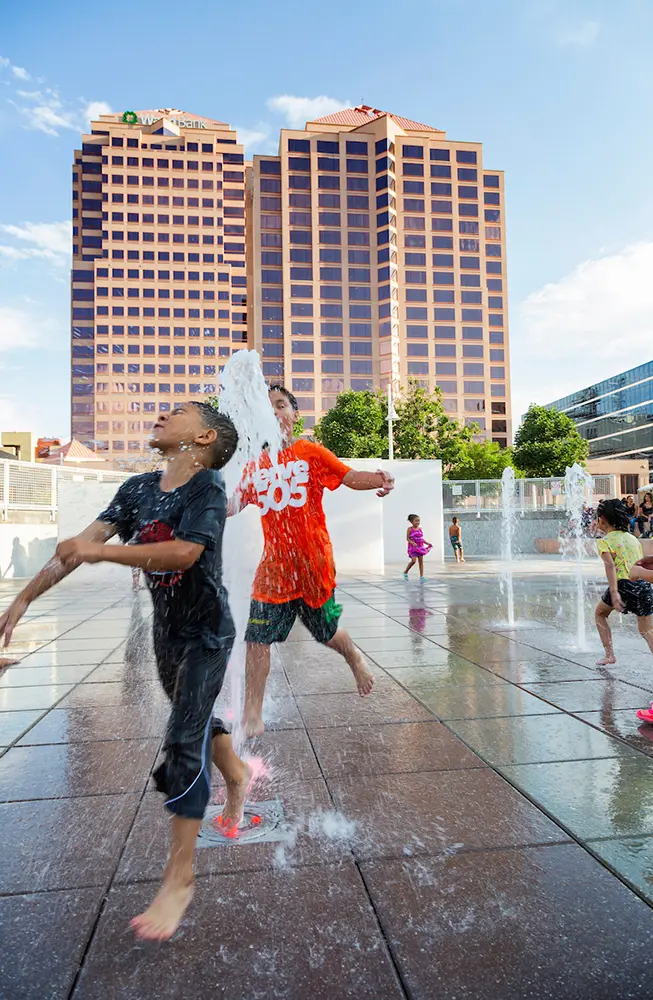 Children play in the Civic Plaza splash pad during Albuquerque's 2021 Juneteenth celebration. The splash pad returns for this year's free festival June 19. (Photo courtesy NM Juneteenth/bccofnm.org)