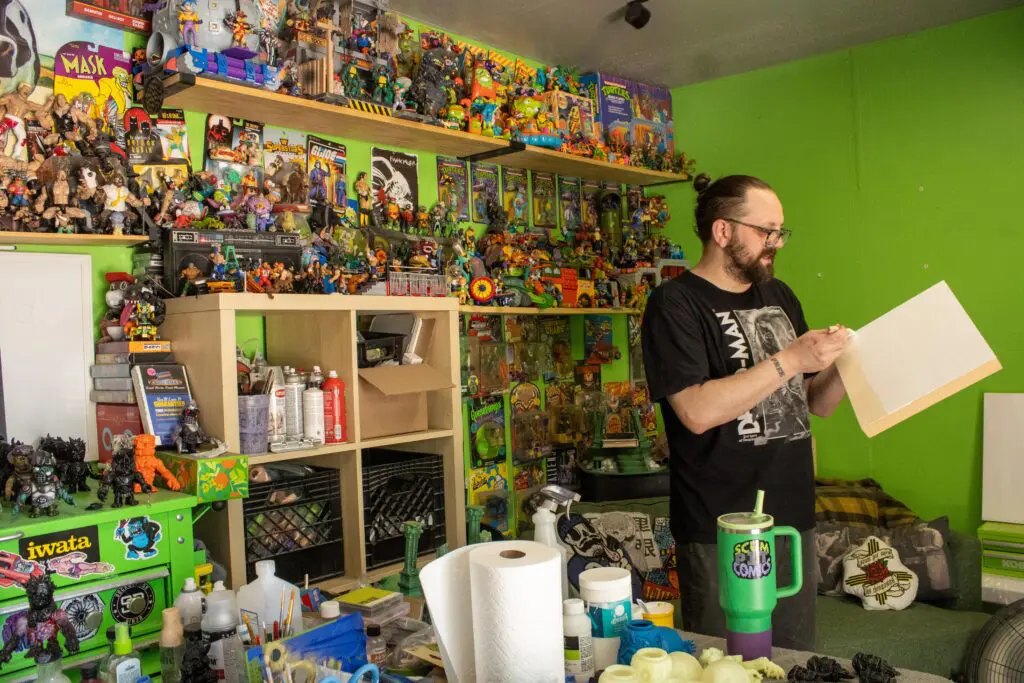Mikee Riggs prepping a canvas in his studio (Photo by Sara Atencio-Gonzales)
