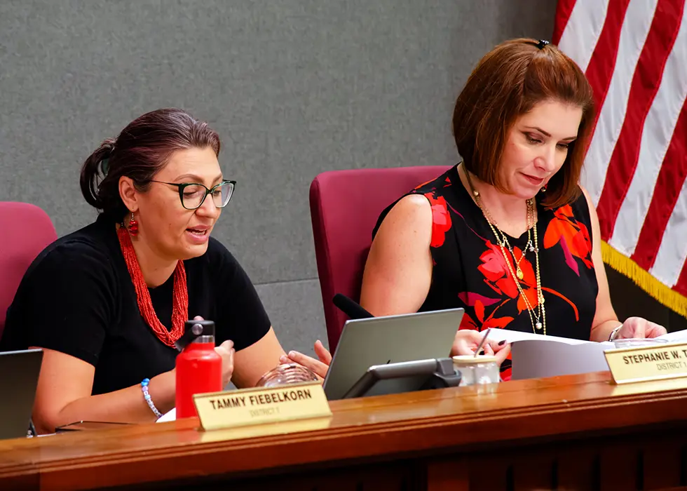 Councilor Brook Bassan, right, listens as Councilor Stephanie Telles discusses amendments to the city’s whistleblower ordinance Monday. The council later unanimously approved the revised measure. (Jesse Jones)