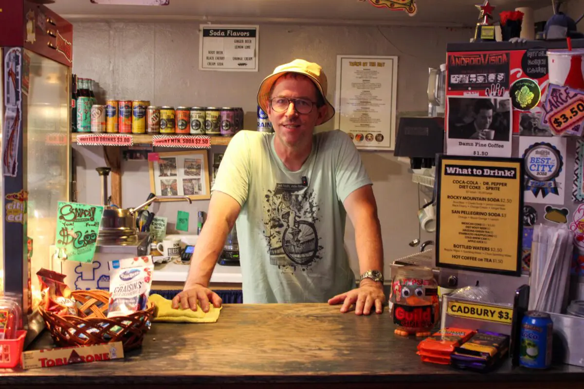 Owner/operator of the Guild Cinema, Keif Henley, behind the concessions counter. (Photo by Julian Paras)