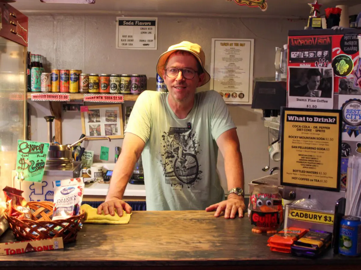 Owner/operator of the Guild Cinema, Keif Henley, behind the concessions counter. (Photo by Julian Paras)
