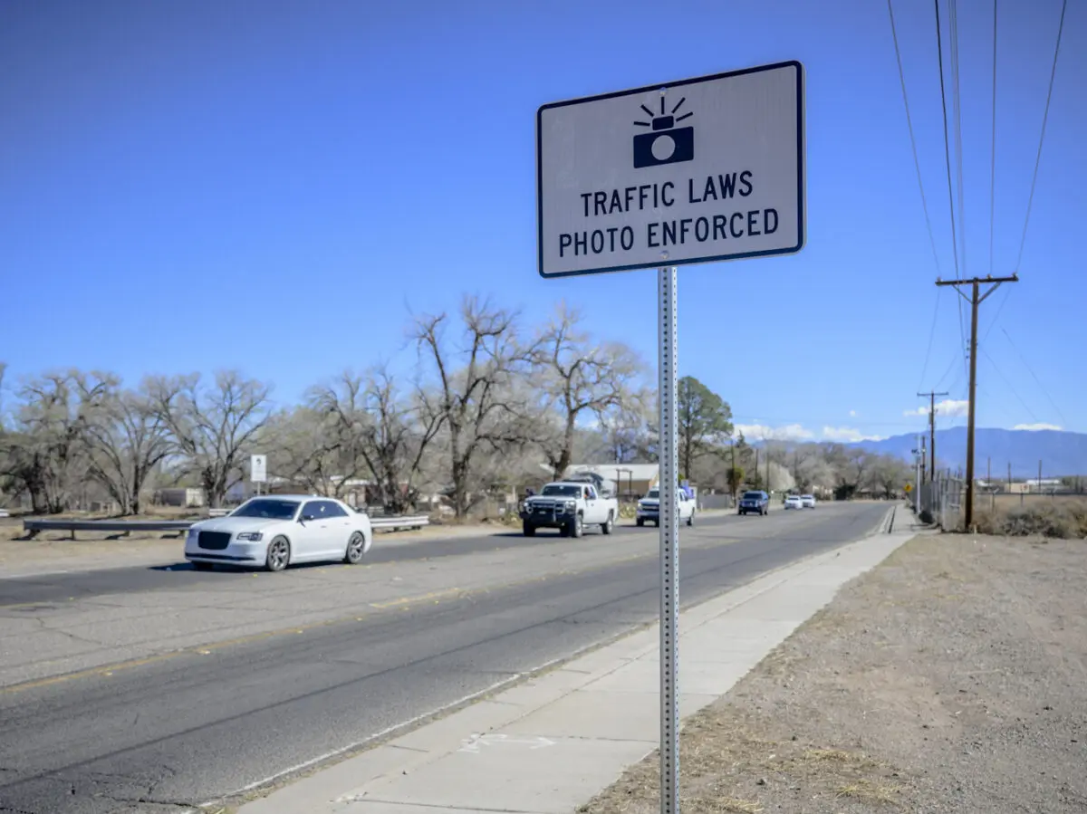 Pictured is a sign warning drivers of photo enforced speed cameras located ahead along Arenal Rd SW between Tapia Blvd and Isleta Blvd in the South Valley. Photo by Roberto E. Rosales / City Desk Abq