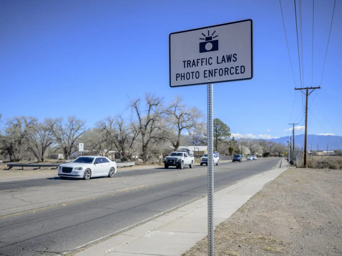 Pictured is a sign warning drivers of photo enforced speed cameras located ahead along Arenal Rd SW between Tapia Blvd and Isleta Blvd in the South Valley. Photo by Roberto E. Rosales / City Desk Abq