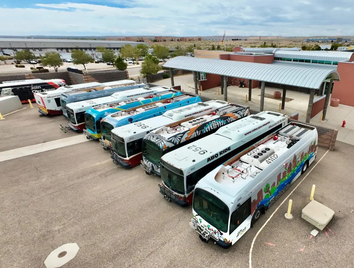 ABQ RIDE’s five electric buses sit among other buses at the Ken Sanchez Transit Center in Albuquerque. The electric buses have not been in service since December because of mechanical problems and difficulty obtaining parts. Photo by Roberto E. Rosales for the Paper