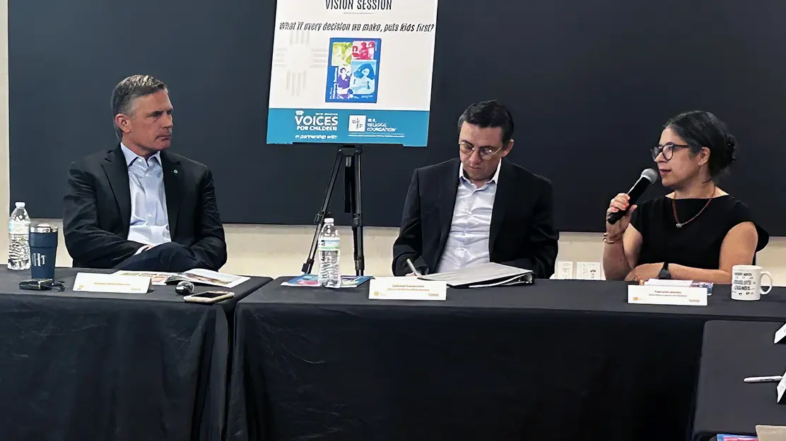 U.S. Sen. Martin Heinrich, left, listens as Gabrielle Uballez, right, speaks with Dahveed Torres-Avila, center, of Heinrich’s office during a roundtable Wednesday at the Resilience Hub in downtown Albuquerque. (Jesse Jones)