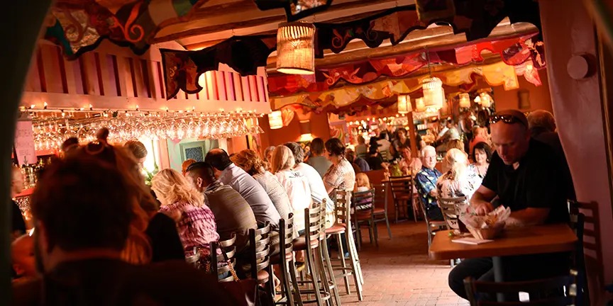 A crowded restaurant/bar at night.