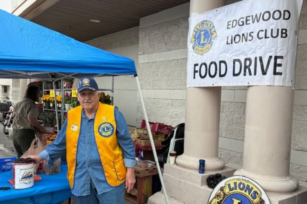 The Edgewood Lions Club and Sandia Mountain Lions Club stocked East Mountain Food Pantry's shelves with 1,500 pounds of food and raised $860 for the pantry. (Courtesy photo)