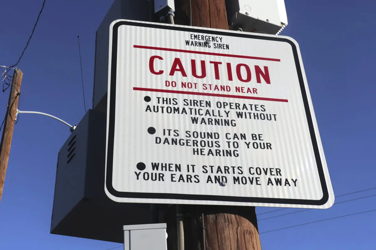 Pictured is a sign explaining the function or the siren