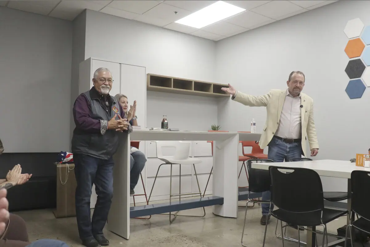 Greggory Hull, right, the Republican candidate for New Mexico governor introduces his running mate, David Gallegos, who is seeking to be the next Lt. governor. They appeared on Tuesday at The Valley Cafe to meet residents and talk about their campaign.