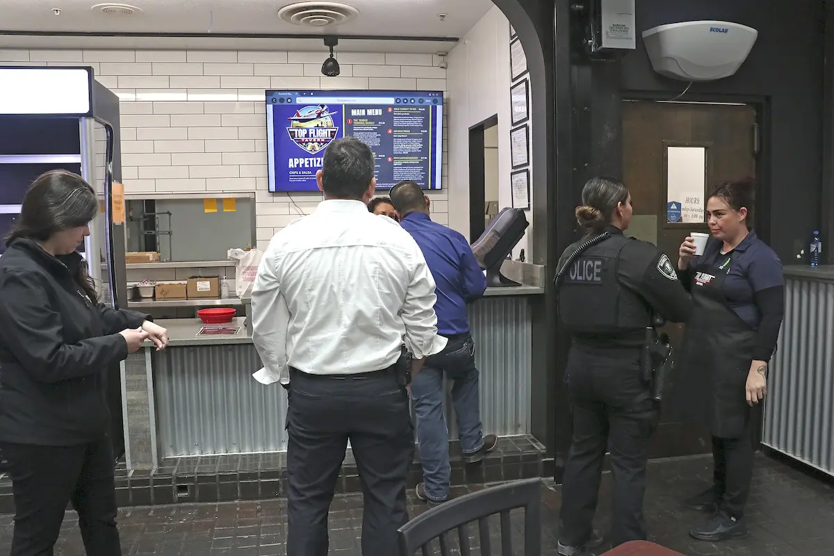 City employees are shown during February's soft opening of the Top Flight Tavern at the Roswell Air Center