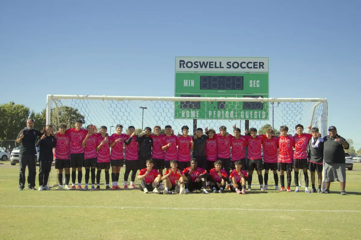 Roswell raises up a finger each to show they're No. 1 in celebration of their district title on Saturday