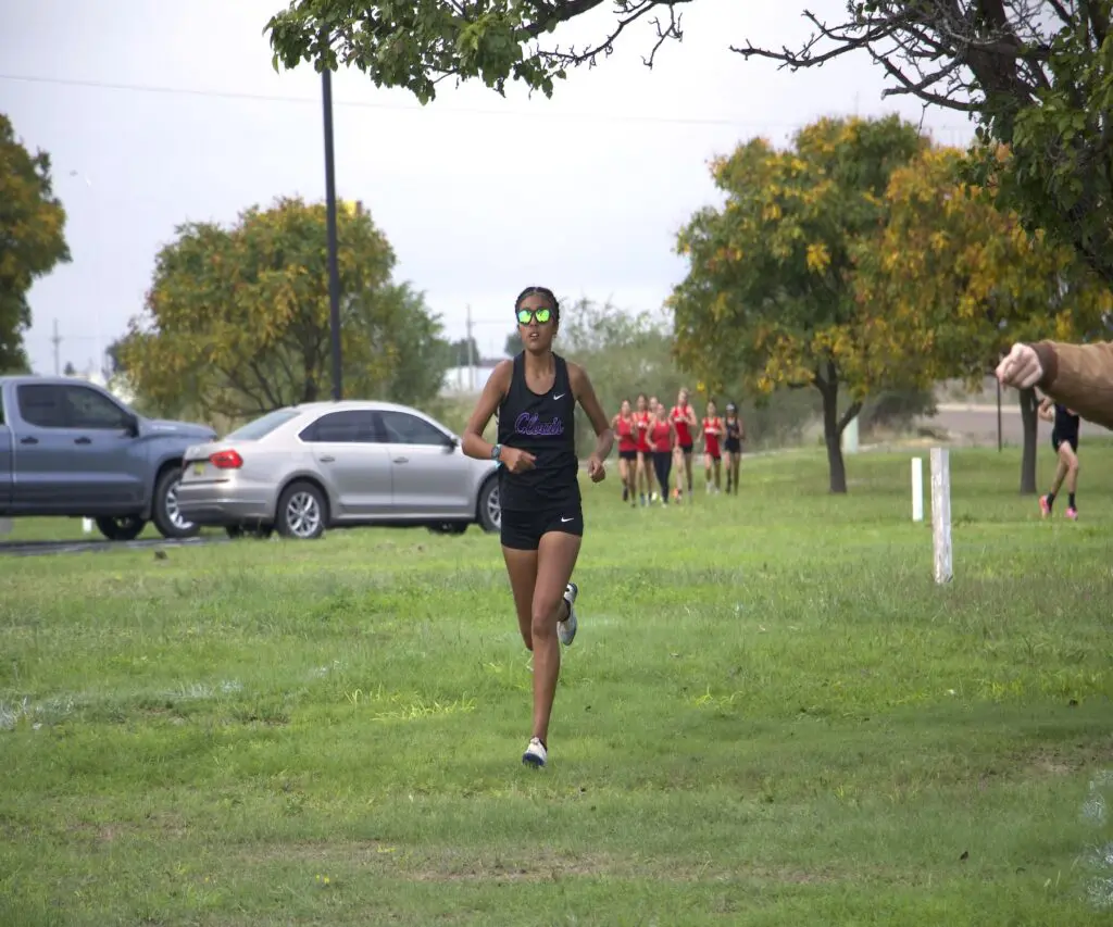 Clovis junior Roselia Morales leads the race at the Pecos Valley Invitational
