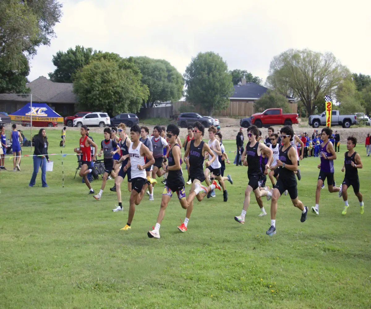 Varsity runners break out of the starting area at the Pecos Valley Invitational