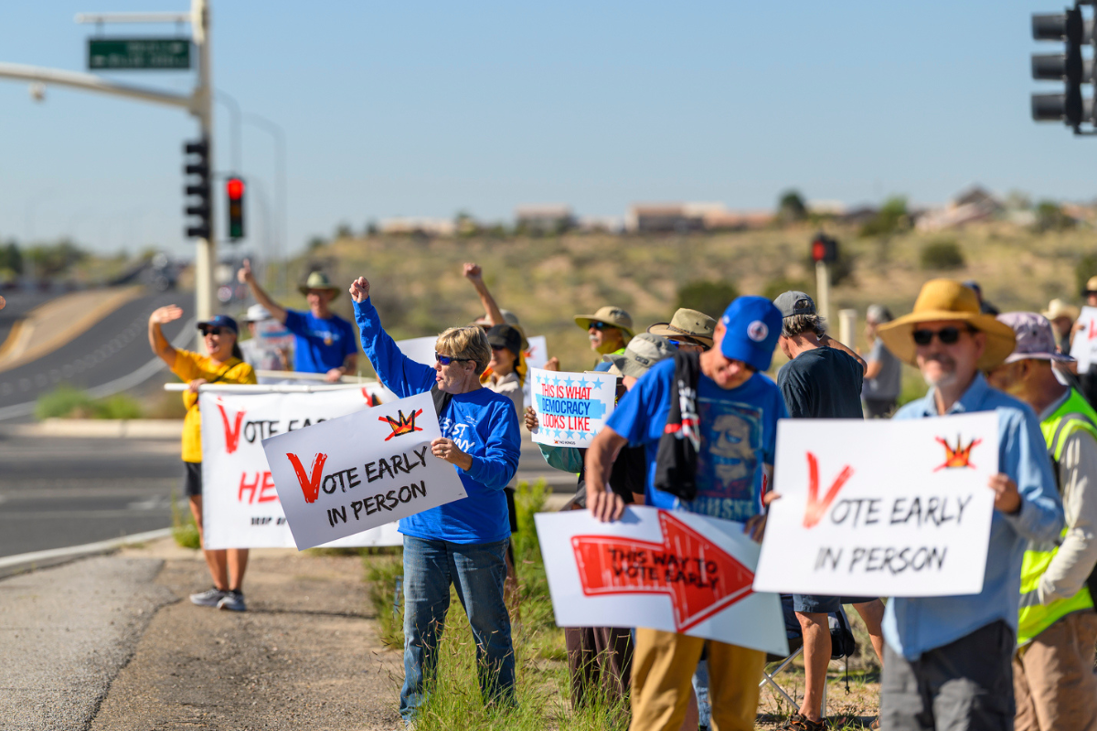 Several dozen folks held a vote early rally Tuesday morning outside the Sandoval County Administration building in Rio Rancho to get the word out early for voting. (Roberto E. Rosales)