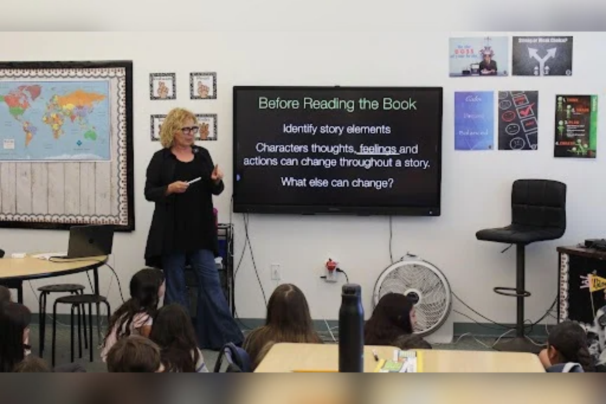 Kennedy Center teaching artist Melanie Rick walks students through story elements before they crack open the book. Her “reading art” strategies teach kids to read illustrations the way they read text. (Courtesy of Rio Rancho Public Schools)
