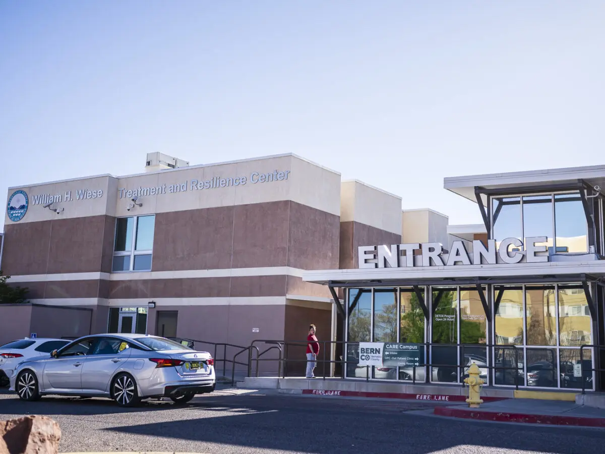 The main entrance to the Bernalillo County CARE Campus, where care managers will review behavioral health and substance use disorder assistance requests submitted through the county’s Close the Loop system. Photo by Roberto E. Rosales/City Desk ABQ.