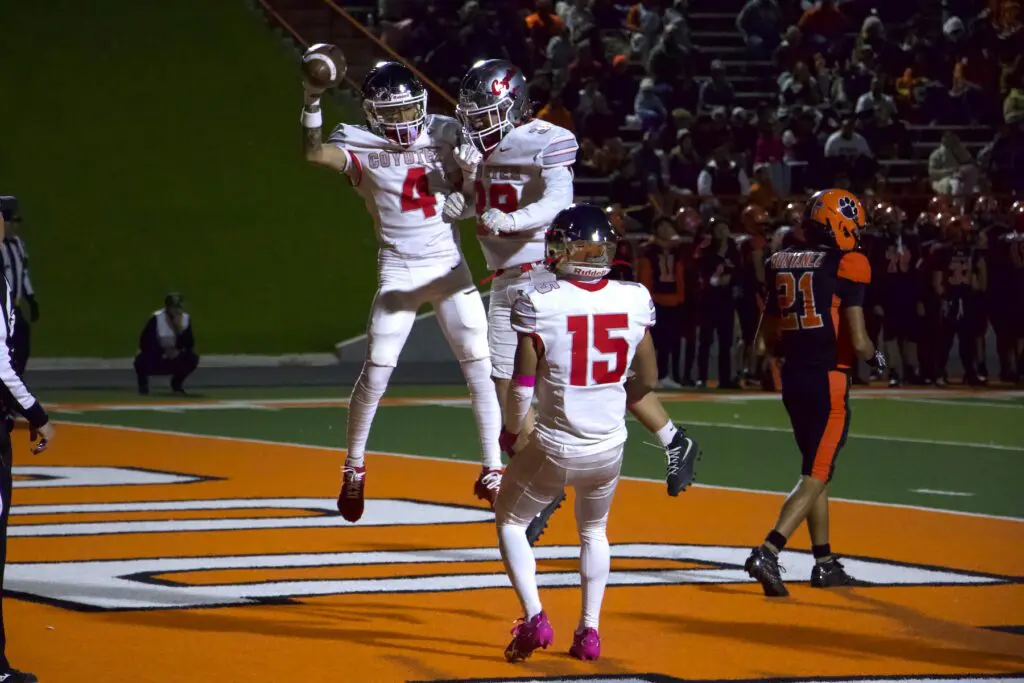 Coyotes celebrate in the end zone at the Bulldog Bowl