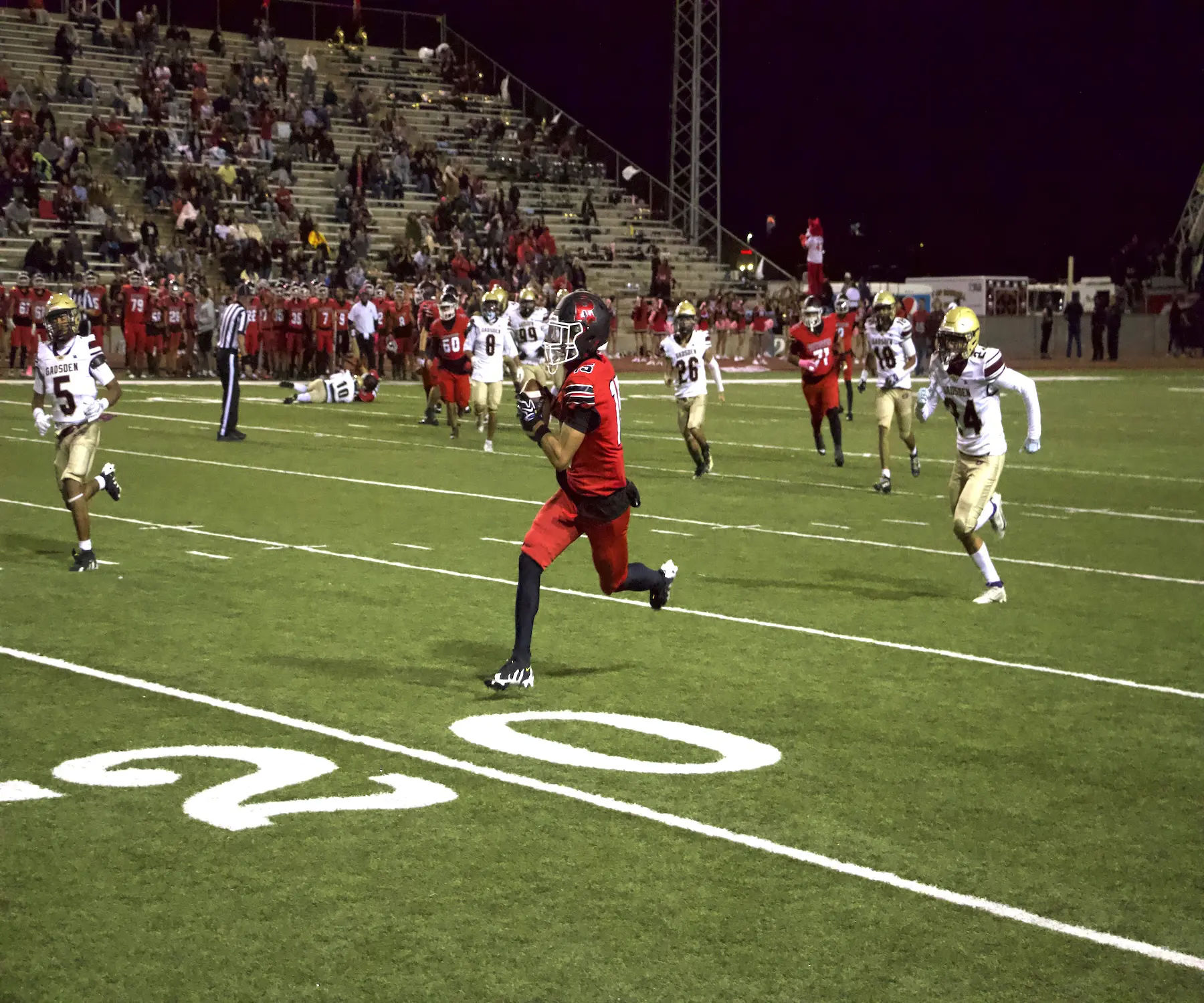 Roswell wideout Danny Castro outruns Gadsden defenders for a touchdown.