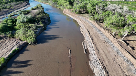 A downstream view of the Rio Grande main channel on May 19, 2026, showing the newly stabilized right riverbank following Phase 1 of the Corrales River Mile 199 Project, with the constructed side channel visible in the upper left. Reclamation photo