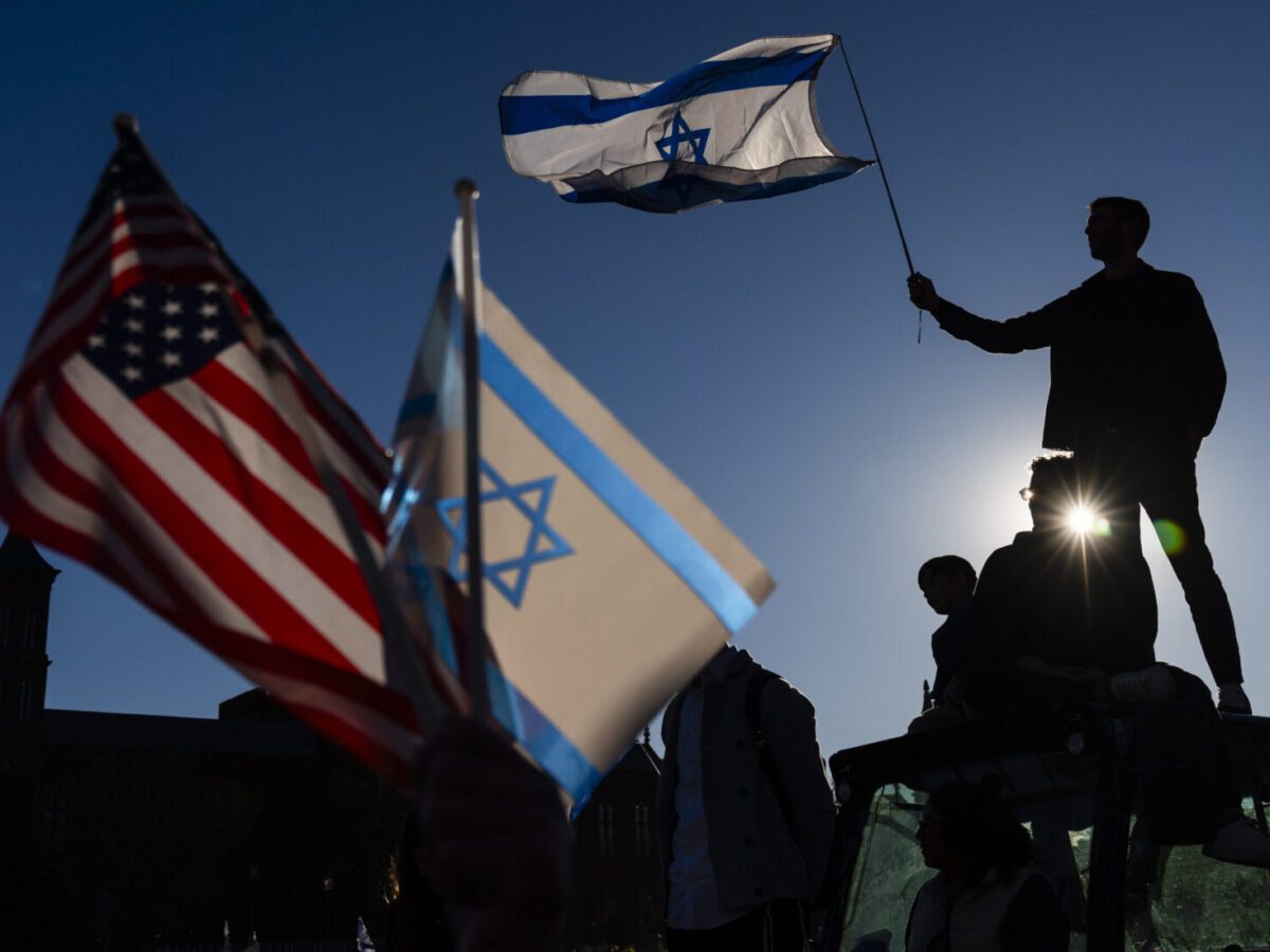 A man waves an Israeli flag during a pro-Israel demonstration on the National Mall in November 2023, about a month after Hamas militants attacked Israel from the Gaza Strip.