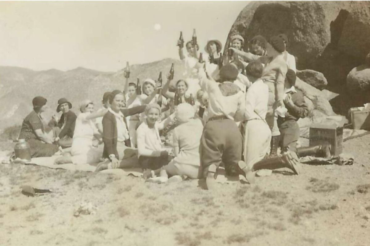 University of New Mexico students gathered at Supper Rock in 1932, just left of nearby “U” mountain. Supper Rock was originally called Cerro Huerfano by settlers under the 1819 Cañon de Carnué Land Grant. Courtesy of Rick Holben, East Mountain Historical Society