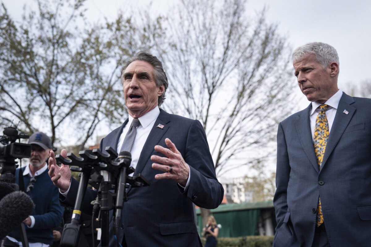 Interior Secretary Doug Burgum, left, and Energy Secretary Chris Wright outside the West Wing at the White House on March 19.