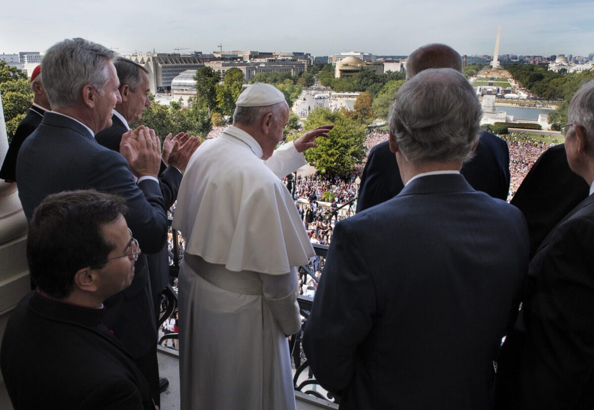 Pope Francis waves to well-wishers from the House speaker's balcony after addressing a joint session of Congress in September 2015.