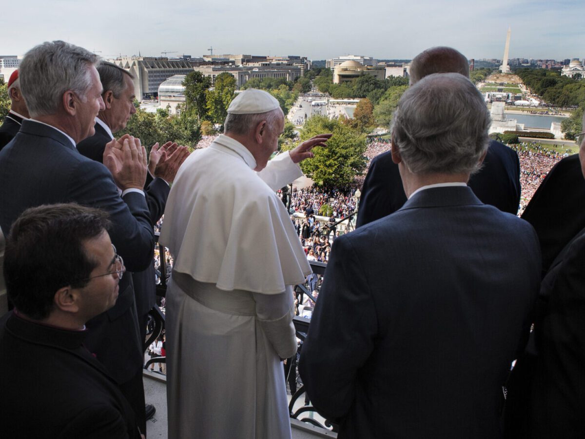 Pope Francis waves to well-wishers from the House speaker's balcony after addressing a joint session of Congress in September 2015.