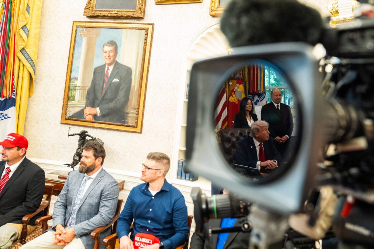 Veterans listen as President Donald Trump answers questions in the Oval Office last week. Demetrius Freeman/The Washington Post