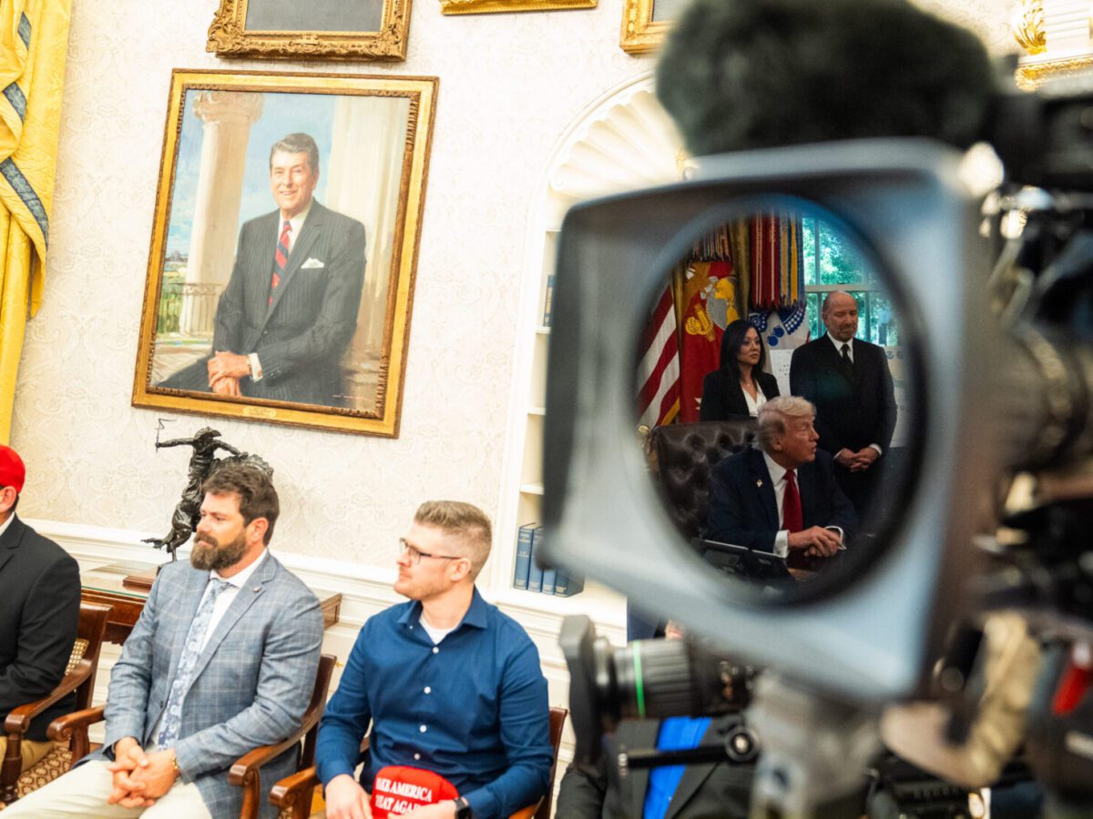 Veterans listen as President Donald Trump answers questions in the Oval Office last week. Demetrius Freeman/The Washington Post