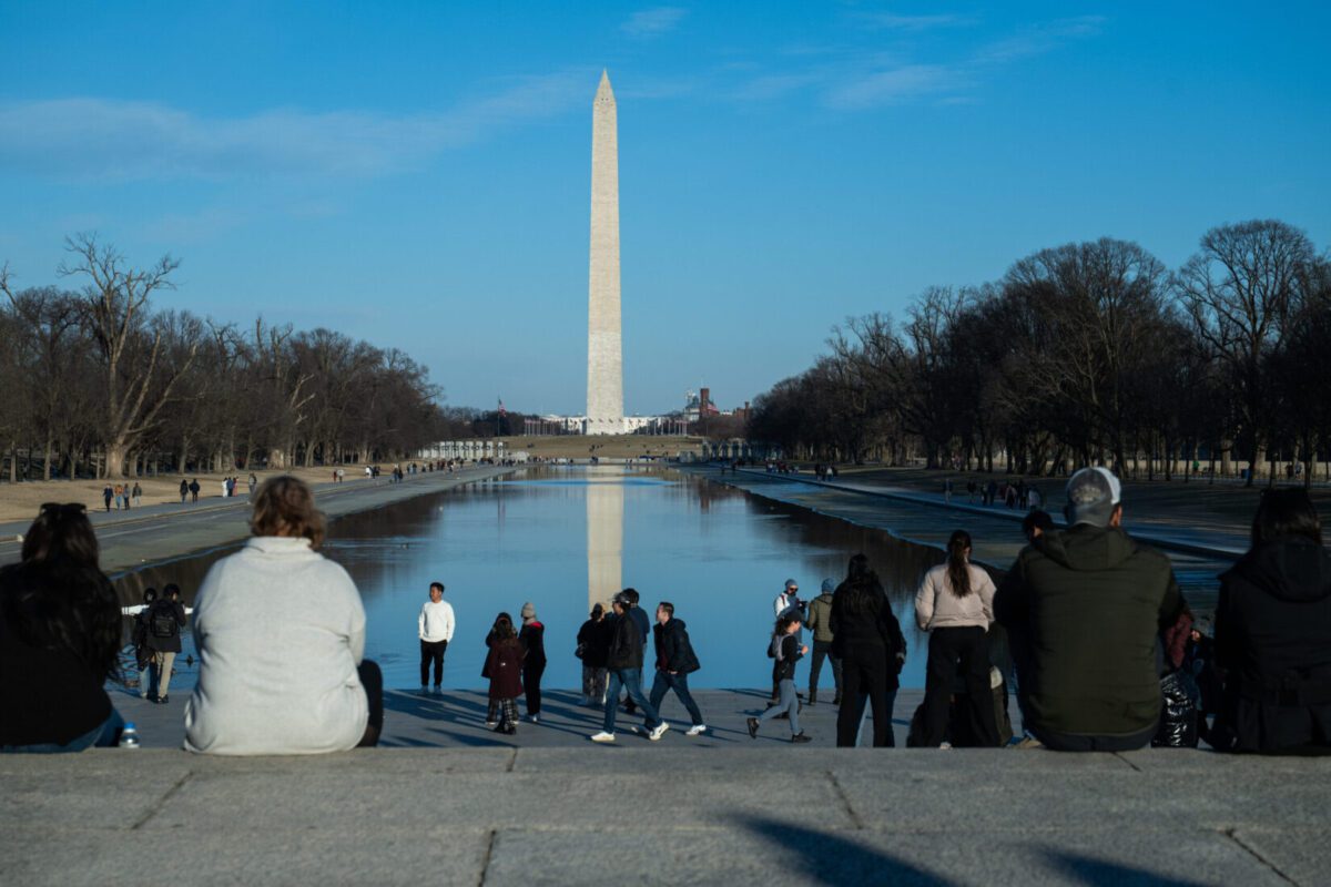 Tourists visit the National Mall in February.