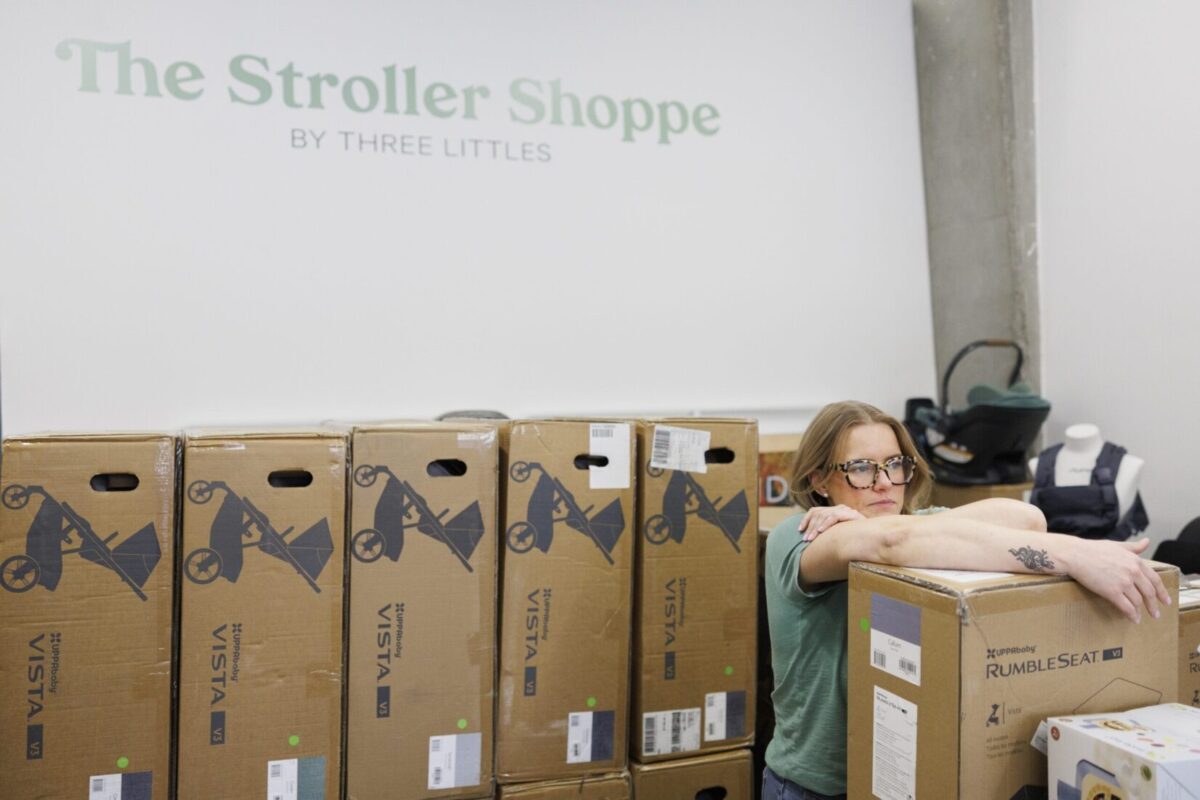 Business owner Elizabeth Mahon rests after stacking overstock inventory items this week at her children’s store Three Littles in Northeast Washington, D.C. Tom Brenner/For The Washington Post