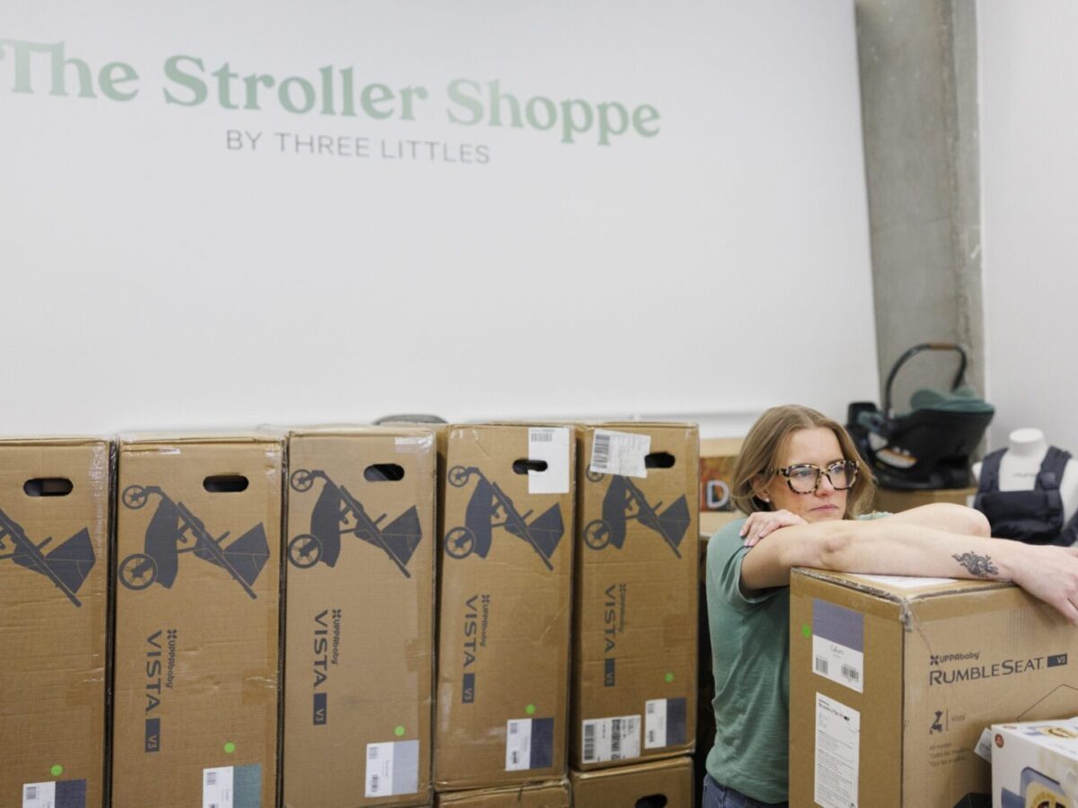 Business owner Elizabeth Mahon rests after stacking overstock inventory items this week at her children’s store Three Littles in Northeast Washington, D.C. Tom Brenner/For The Washington Post