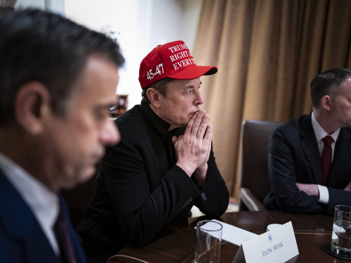 Elon Musk listens to President Donald Trump during a Cabinet meeting at the White House on March 24.