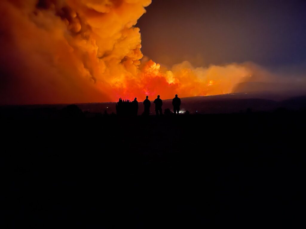 U.S. Forest Service firefighters watch as the Hermits Peak/Calf Canyon Fire burns in northern New Mexico / USFS (May 21, 2022)