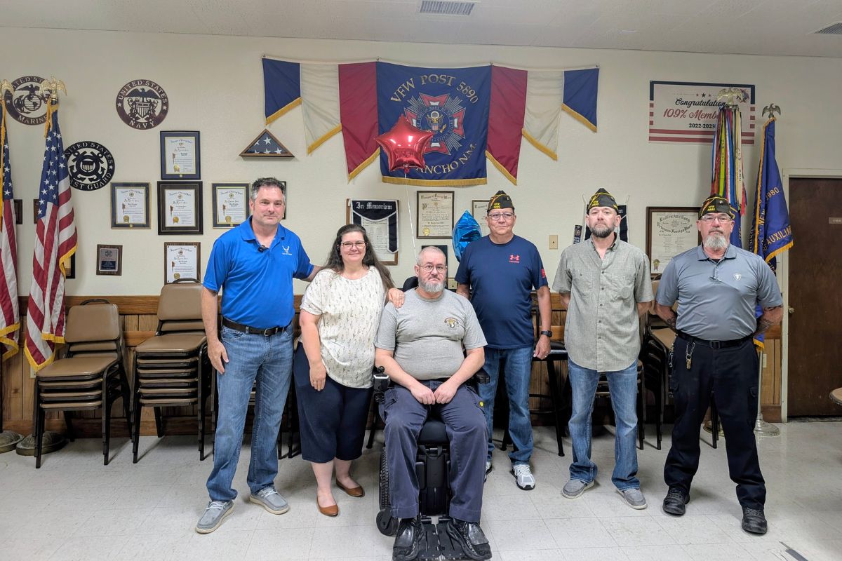 James Green, center, received a donated wheelchair July 26 that his family desperately needed after encountering delays in the federal veterans' system, highlighting challenges faced by disabled veterans across the state.