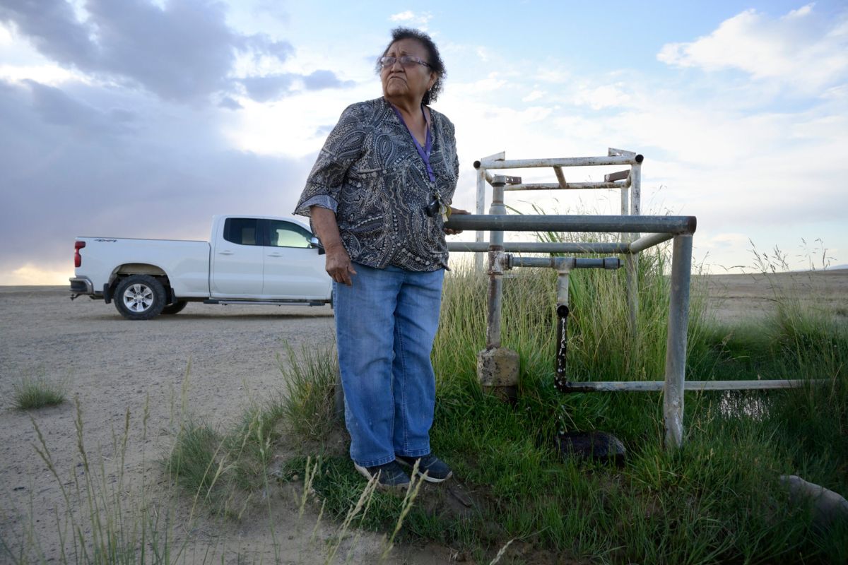 Loretta Johnson stands by a water well on the Navajo Nation in New Mexico. According to an EPA report, the well produces water tainted with arsenic. All photos by Jerry Redfern.