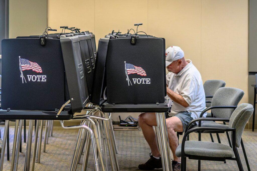 A New Mexico voter heads to the polls at Tijeras Village Hall. A federal judge ruled this week that voters' personal data, including Social Security numbers, will stay protected from a DOJ lawsuit. Photo by Roberto E. Rosales/City Desk ABQ.