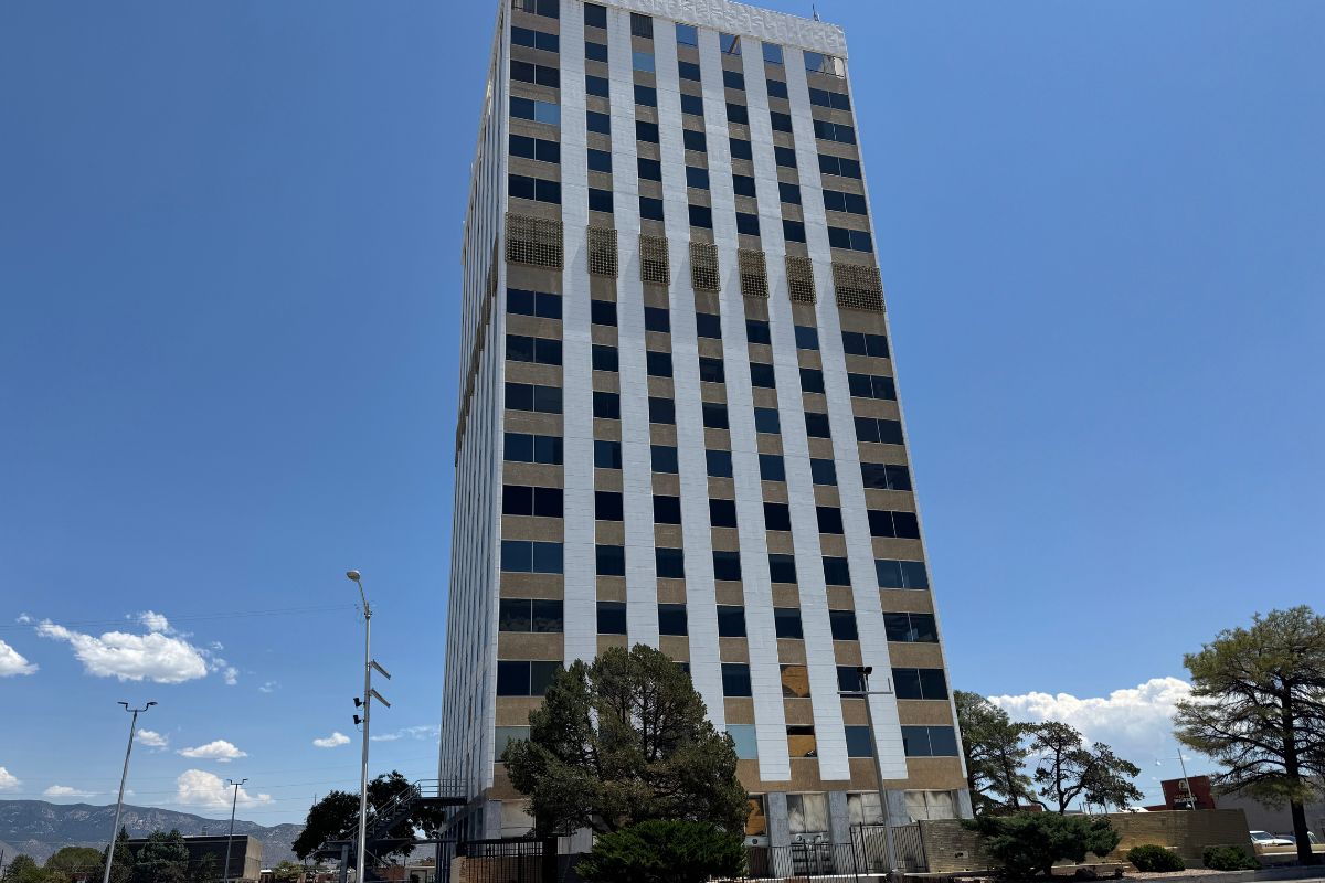 The smaller of two towers at San Mateo and Central is clad with 23K gold tiles and stands empty pending redevelopment / City Desk ABQ