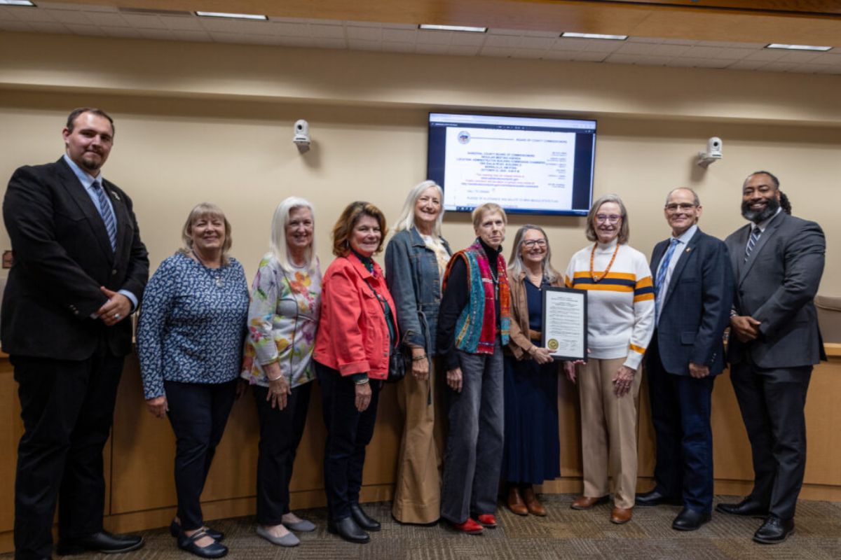 From Left to Right: Vice Chair Jordan Juarez, District 4, Linda Lockett, Jean Roberts, Kathleen Hayes, Kathy Suydam, Nancy Evans, Commissioner Katherine A. Bruch, District 1, Janice Grann, Chair Michael Meek, District 3, and Joshua Jones, District 5.
