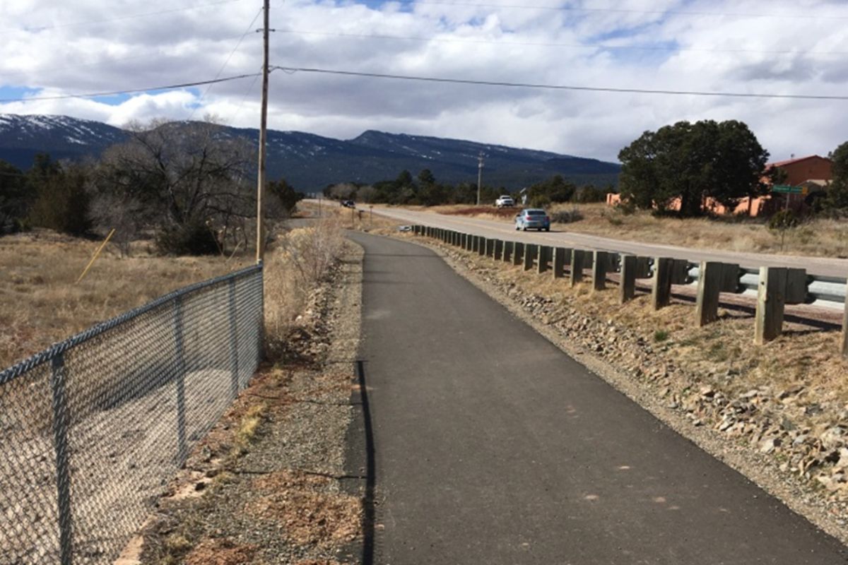 Bernallilo County commissioners have approved a $1.6 million contract to build a nearly 2-mile multiuse trail in the East Mountains, officials announced Tuesday.