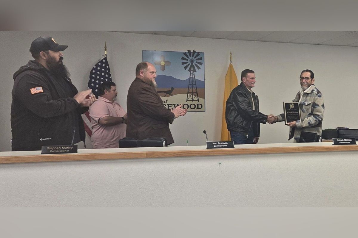 Edgewood community members and officials gathered Dec. 23 to honor outgoing Commissioner Filandro Anaya, right, for his leadership during the town’s transition to a new form of government. (Town of Edgewood)