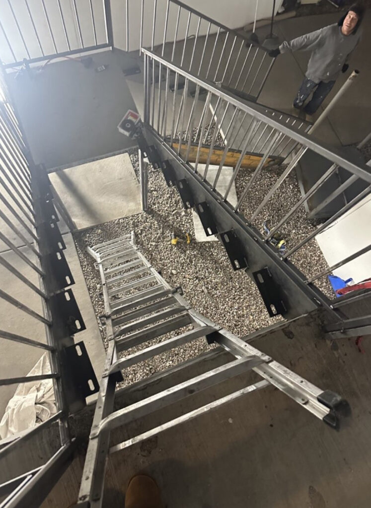 Alvarado Apartments residents said management removed entire staircases during unannounced renovations, which included replacing missing stairs with a ladder. (Courtesy photo)