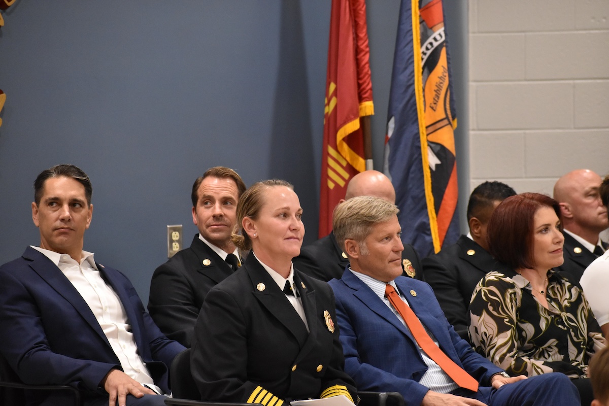 from AFR: IAFF Local 244 President Miguel Tittmann, left, Deputy Chief Clint Anderson, Fire Chief Emily Jaramillo, Mayor Tim Keller and then-Council President Brook Bassan watch an AFR promotion ceremony at the Fire Academy in 2025.